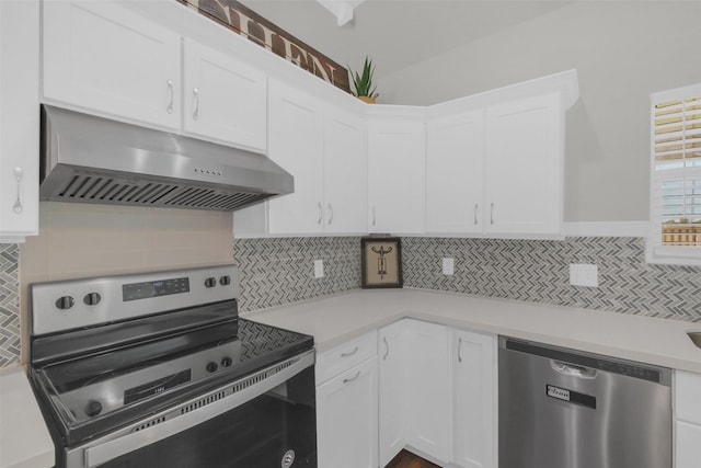 9206 Gene St, Needville, TX 77461 - kitchen featuring appliances with stainless steel finishes, exhaust hood, decorative backsplash, light countertops, and white cabinets