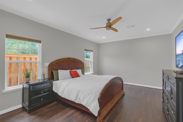 9206 Gene St, Needville, TX 77461 - bedroom with multiple windows, dark wood finished floors, crown molding, recessed lighting, and a ceiling fan