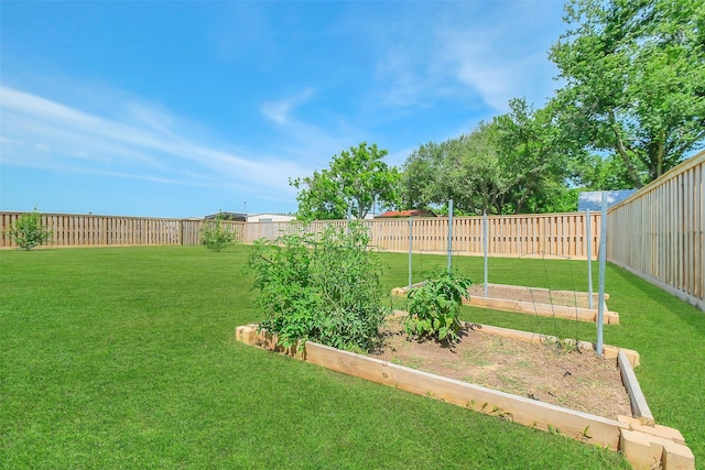 9206 Gene St, Needville, TX 77461 - fenced backyard featuring a vegetable garden