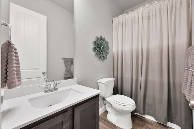17413 Turtleweed Ln, Conroe, TX 77385 - bathroom featuring wood finished floors, vanity, toilet, and a shower with shower curtain