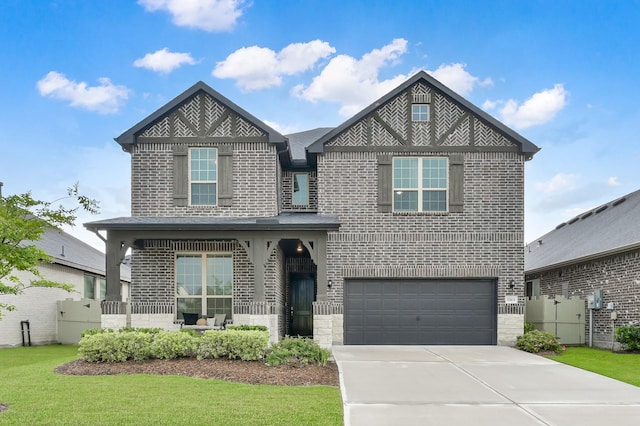 17413 Turtleweed Ln, Conroe, TX 77385 - view of front of house featuring a garage, brick siding, driveway, and a front lawn