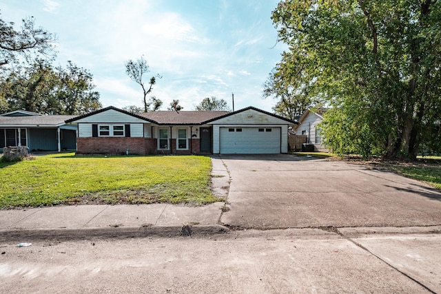 204 Carnation St, Lake Jackson, TX 77566 - ranch-style house with an attached garage, driveway, a front yard, and brick siding