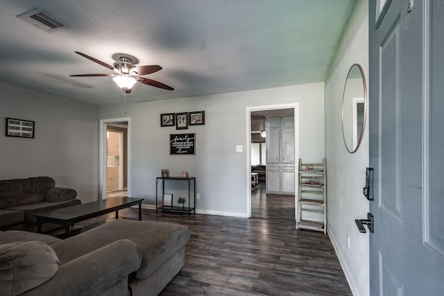 204 Carnation St, Lake Jackson, TX 77566 - living area with ceiling fan, baseboards, and dark wood-style flooring