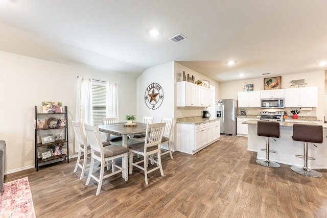 128 Barton Creek Dr, Huntsville, TX 77340 - dining room featuring light wood finished floors, recessed lighting, and baseboards