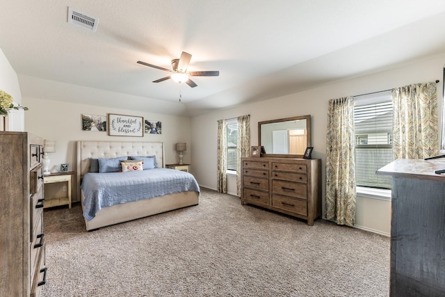 128 Barton Creek Dr, Huntsville, TX 77340 - carpeted bedroom featuring multiple windows, a ceiling fan, and baseboards