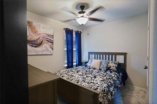 15482 Sicomoro Viejo St, Channelview, TX 77530 - bedroom with marble look tiles, ceiling fan, and baseboards