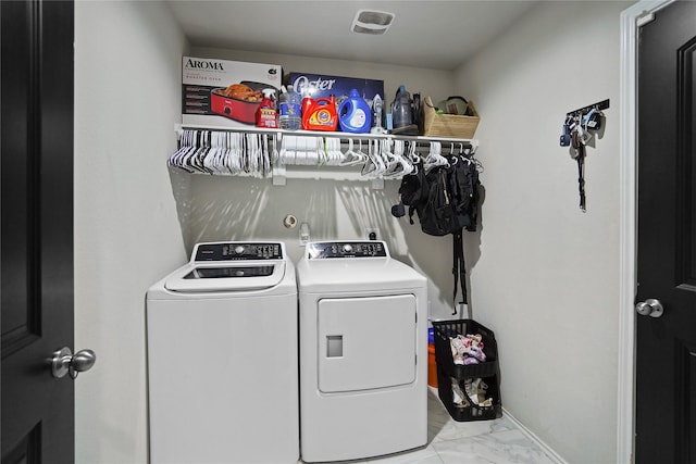 15482 Sicomoro Viejo St, Channelview, TX 77530 - laundry room with independent washer and dryer, light marble finish flooring, and baseboards
