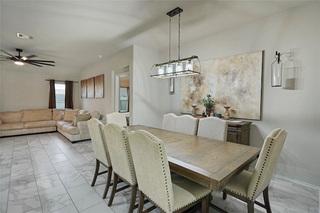 15482 Sicomoro Viejo St, Channelview, TX 77530 - dining area with light marble finish flooring and a ceiling fan