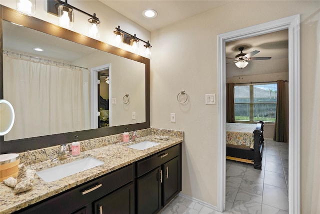15482 Sicomoro Viejo St, Channelview, TX 77530 - ensuite bathroom with marble look tile flooring, double vanity, baseboards, a ceiling fan, and recessed lighting