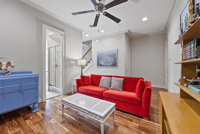 3909 Rose St, Houston, TX 77007 - living room featuring crown molding, wood finished floors, a ceiling fan, baseboards, and stairway