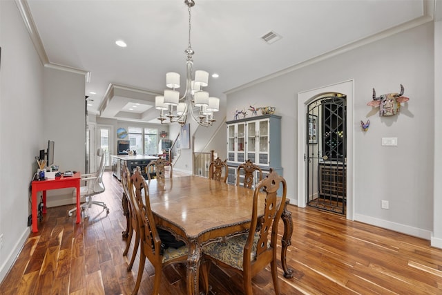 3909 Rose St, Houston, TX 77007 - dining room with wood finished floors, ornamental molding, a chandelier, baseboards, and recessed lighting