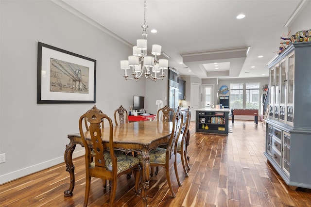 3909 Rose St, Houston, TX 77007 - dining room featuring a chandelier, dark wood-style floors, recessed lighting, baseboards, and a raised ceiling