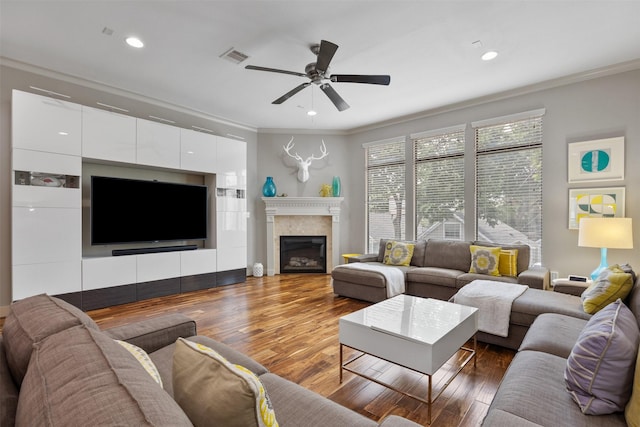 3909 Rose St, Houston, TX 77007 - living room with crown molding, ceiling fan, wood finished floors, a fireplace, and recessed lighting