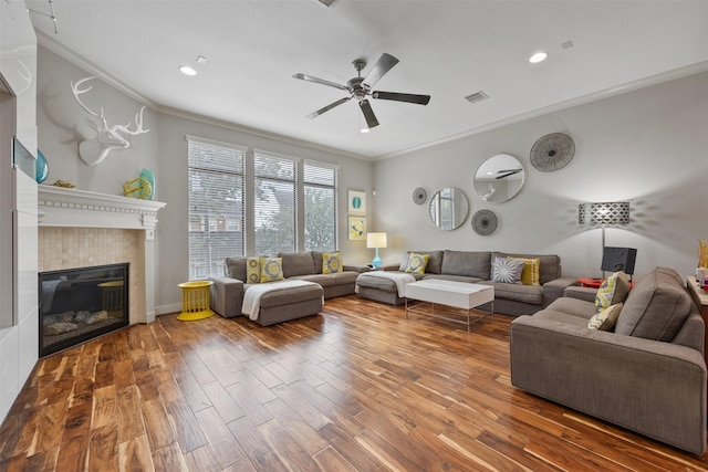 3909 Rose St, Houston, TX 77007 - living area featuring ornamental molding, wood finished floors, ceiling fan, recessed lighting, and a fireplace