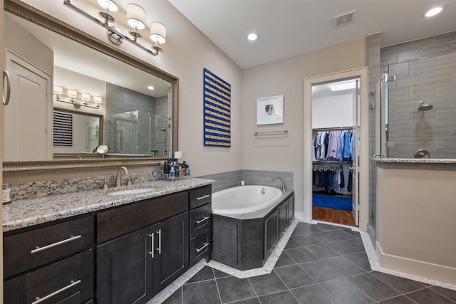 3909 Rose St, Houston, TX 77007 - full bathroom with tile patterned flooring, a stall shower, vanity, a tub with jets, and recessed lighting