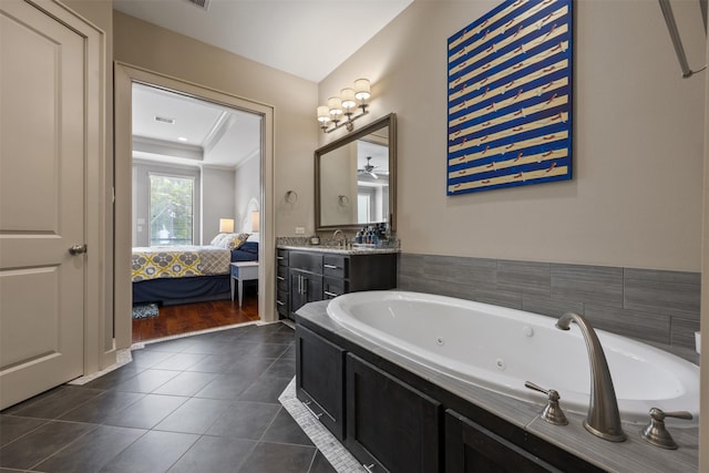 3909 Rose St, Houston, TX 77007 - full bath featuring ensuite bath, a whirlpool tub, vanity, tile patterned floors, and a ceiling fan