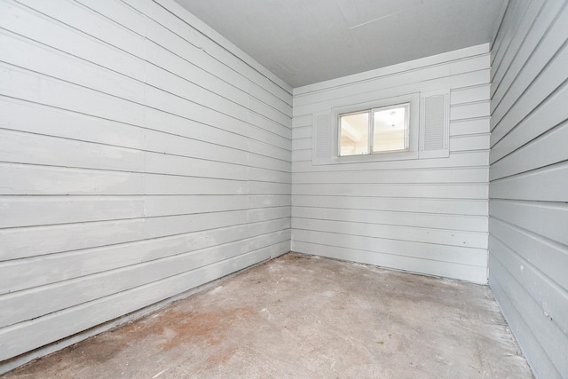 44 Farrell St, Houston, TX 77022 - spare room with concrete floors and wooden walls