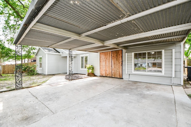44 Farrell St, Houston, TX 77022 - view of patio / terrace featuring an attached carport