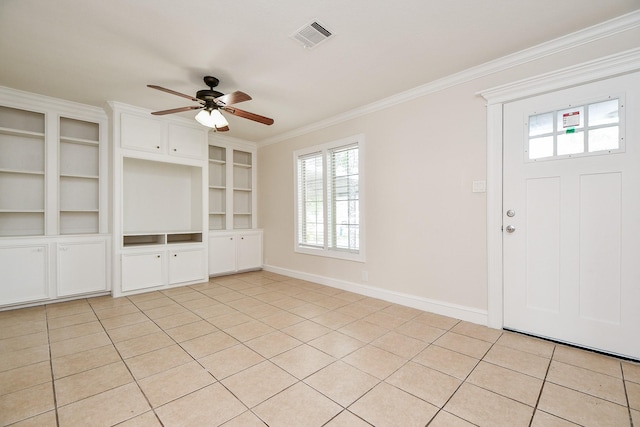 44 Farrell St, Houston, TX 77022 - entrance foyer featuring ornamental molding, a ceiling fan, plenty of natural light, and baseboards