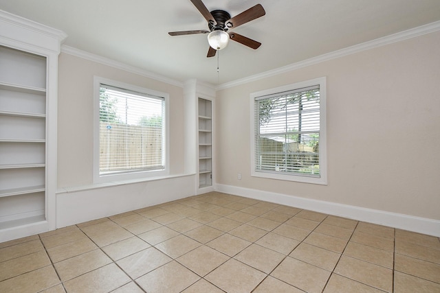 44 Farrell St, Houston, TX 77022 - spare room featuring built in features, ceiling fan, ornamental molding, light tile patterned floors, and baseboards