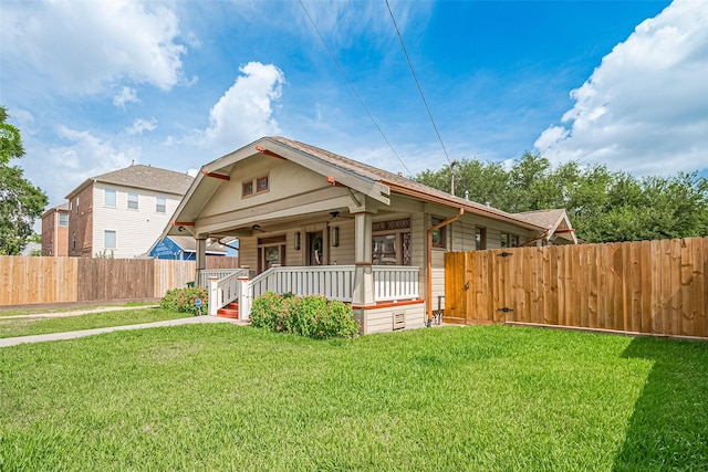 901 W 21st St, Houston, TX 77008 - bungalow-style house featuring a porch, a gate, and a ceiling fan
