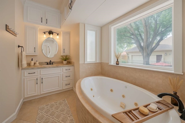 901 W 21st St, Houston, TX 77008 - bathroom with vanity, a whirlpool tub, and tile patterned flooring