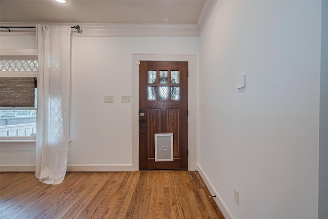 901 W 21st St, Houston, TX 77008 - entryway featuring light wood-style floors and ornamental molding