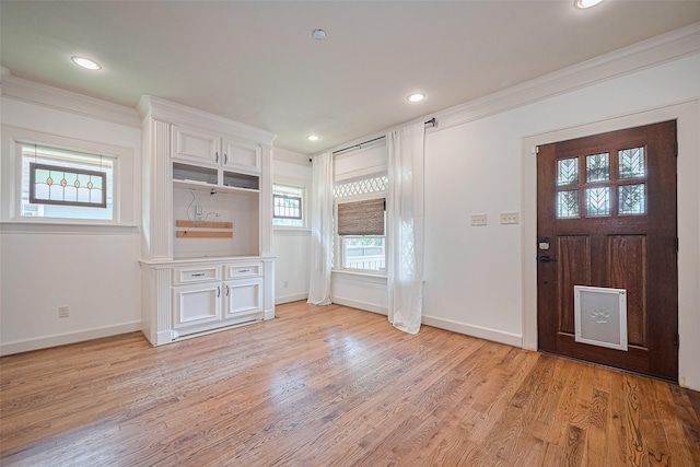 901 W 21st St, Houston, TX 77008 - foyer with light wood-style floors, ornamental molding, and recessed lighting