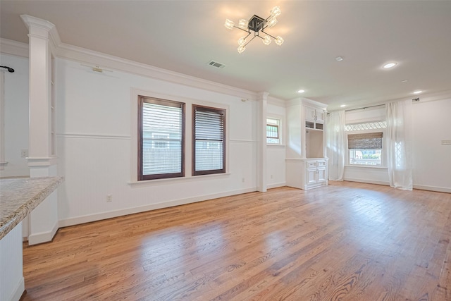 901 W 21st St, Houston, TX 77008 - unfurnished living room with light wood-type flooring, ornamental molding, recessed lighting, and decorative columns