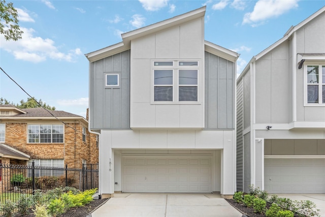 1816 Rosedale St, Houston, TX 77004 - contemporary home with driveway, an attached garage, and board and batten siding