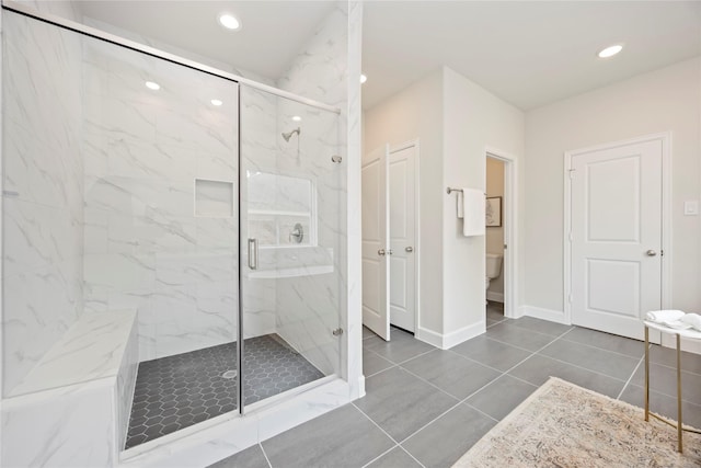 1816 Rosedale St, Houston, TX 77004 - full bath featuring a marble finish shower, toilet, baseboards, recessed lighting, and tile patterned flooring