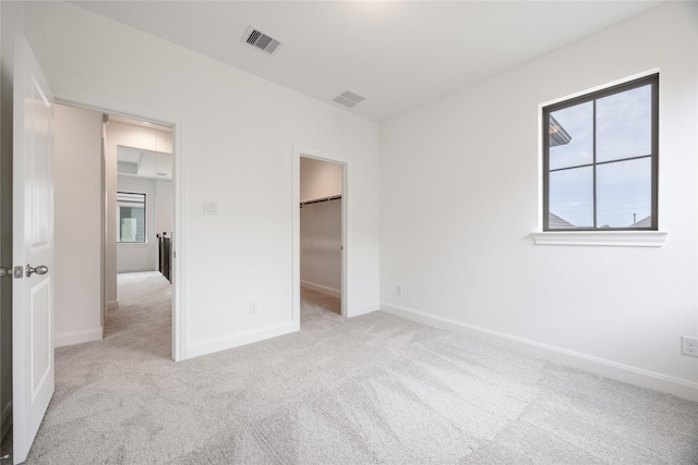 825 Coronado Terrace Ln, Katy, TX 77493 - unfurnished bedroom with carpet and a walk in closet