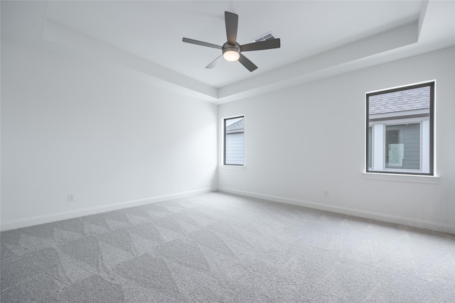 825 Coronado Terrace Ln, Katy, TX 77493 - carpeted spare room featuring a tray ceiling and a ceiling fan