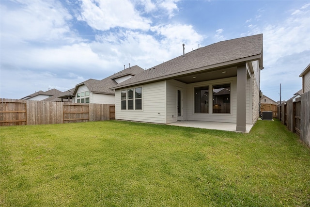 825 Coronado Terrace Ln, Katy, TX 77493 - back of house with a patio area, a fenced backyard, and roof with shingles