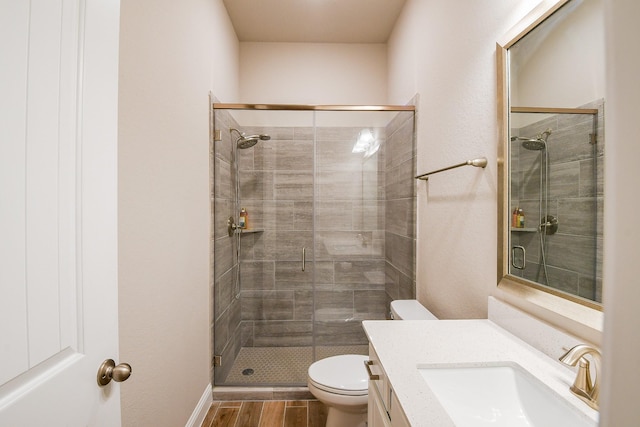 2234 Clements Shore Ln, La Porte, TX 77571 - bathroom featuring toilet, wood finished floors, vanity, and a shower stall