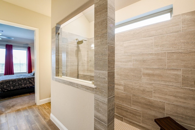 2234 Clements Shore Ln, La Porte, TX 77571 - ensuite bathroom featuring a walk in shower, wood finished floors, plenty of natural light, and baseboards