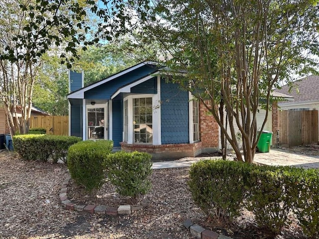 12107 Westwold Dr, Tomball, TX 77377 - view of front of home featuring a chimney and brick siding