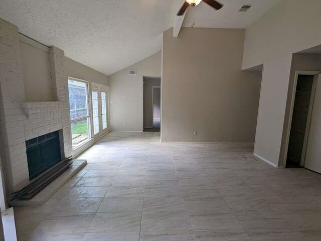 12107 Westwold Dr, Tomball, TX 77377 - unfurnished living room featuring a ceiling fan, a fireplace, a textured ceiling, baseboards, and beamed ceiling
