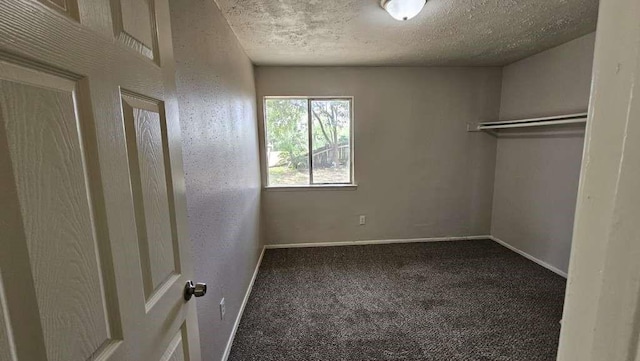 12107 Westwold Dr, Tomball, TX 77377 - unfurnished bedroom with a textured ceiling, carpet flooring, and baseboards