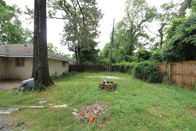3911 Hermitage Hollow Ln, Houston, TX 77339 - view of yard featuring an outdoor fire pit
