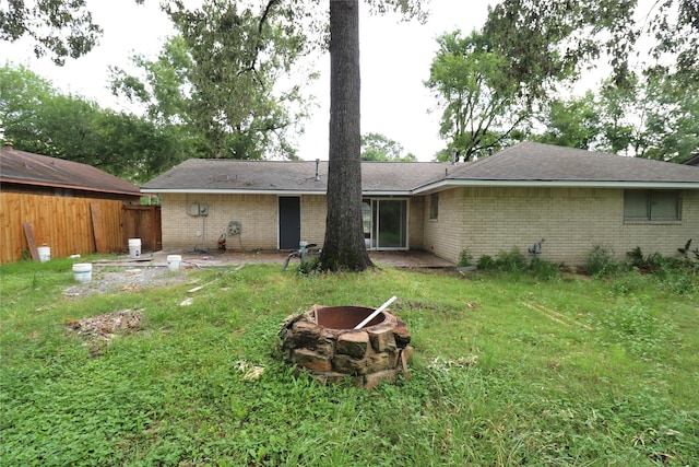 3911 Hermitage Hollow Ln, Houston, TX 77339 - back of property with a fire pit and brick siding