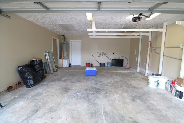 3911 Hermitage Hollow Ln, Houston, TX 77339 - garage featuring water heater and a garage door opener