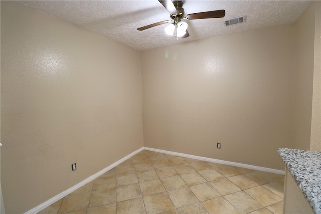 3911 Hermitage Hollow Ln, Houston, TX 77339 - empty room featuring a textured ceiling, ceiling fan, baseboards, and light tile patterned flooring