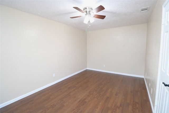 3911 Hermitage Hollow Ln, Houston, TX 77339 - unfurnished room featuring dark wood finished floors, baseboards, a ceiling fan, and a textured ceiling