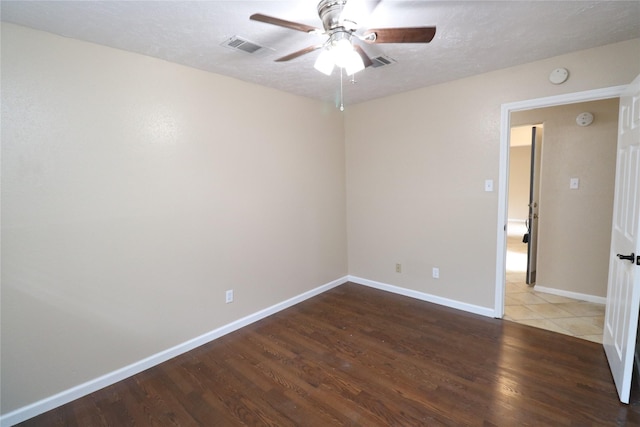 3911 Hermitage Hollow Ln, Houston, TX 77339 - spare room with wood finished floors, ceiling fan, baseboards, a smoke detector, and a textured ceiling