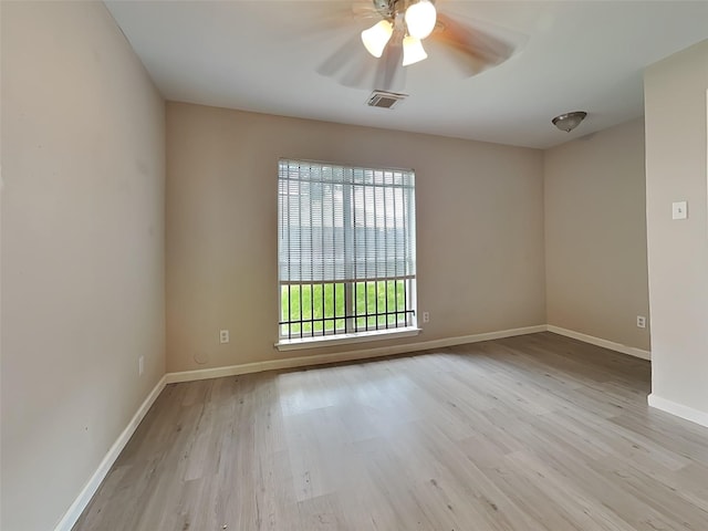12811 Roandale Dr, Houston, TX 77048 - empty room featuring wood finished floors, ceiling fan, and baseboards