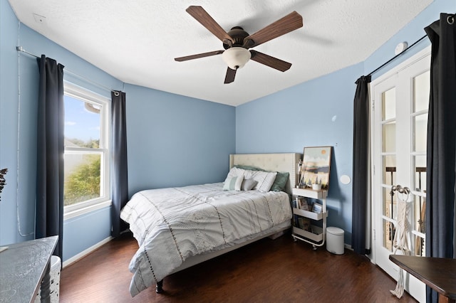 4807 Louisa Ct, Sugar Land, TX 77478 - bedroom featuring wood finished floors, a ceiling fan, a textured ceiling, and baseboards