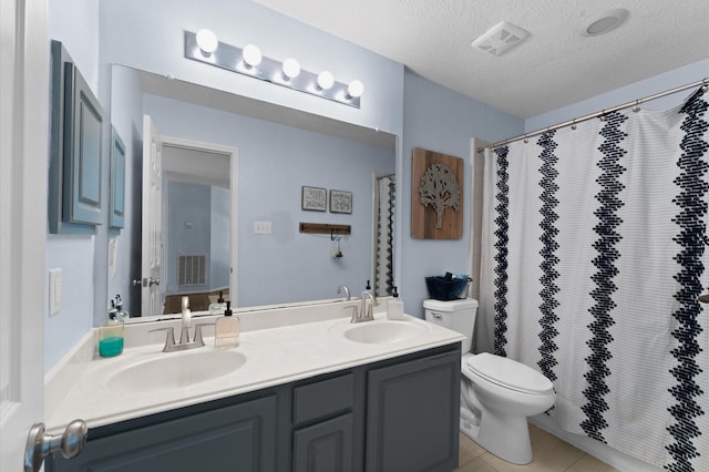 4807 Louisa Ct, Sugar Land, TX 77478 - full bath featuring toilet, double vanity, a textured ceiling, and a shower with shower curtain