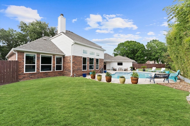 4807 Louisa Ct, Sugar Land, TX 77478 - back of property featuring brick siding, a patio, a chimney, and a shingled roof