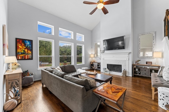 4807 Louisa Ct, Sugar Land, TX 77478 - living room with high vaulted ceiling, a ceiling fan, a fireplace, wood finished floors, and baseboards